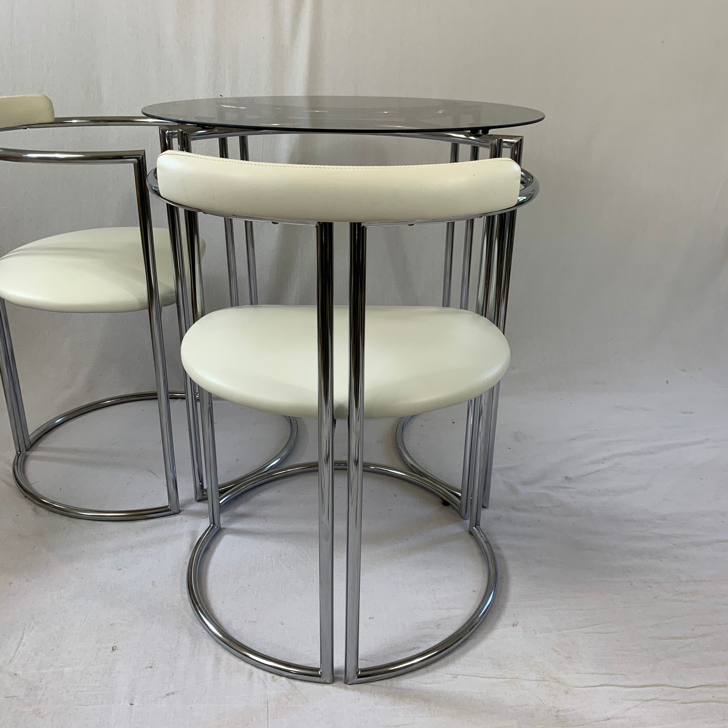 Chrome table and two modernist chairs