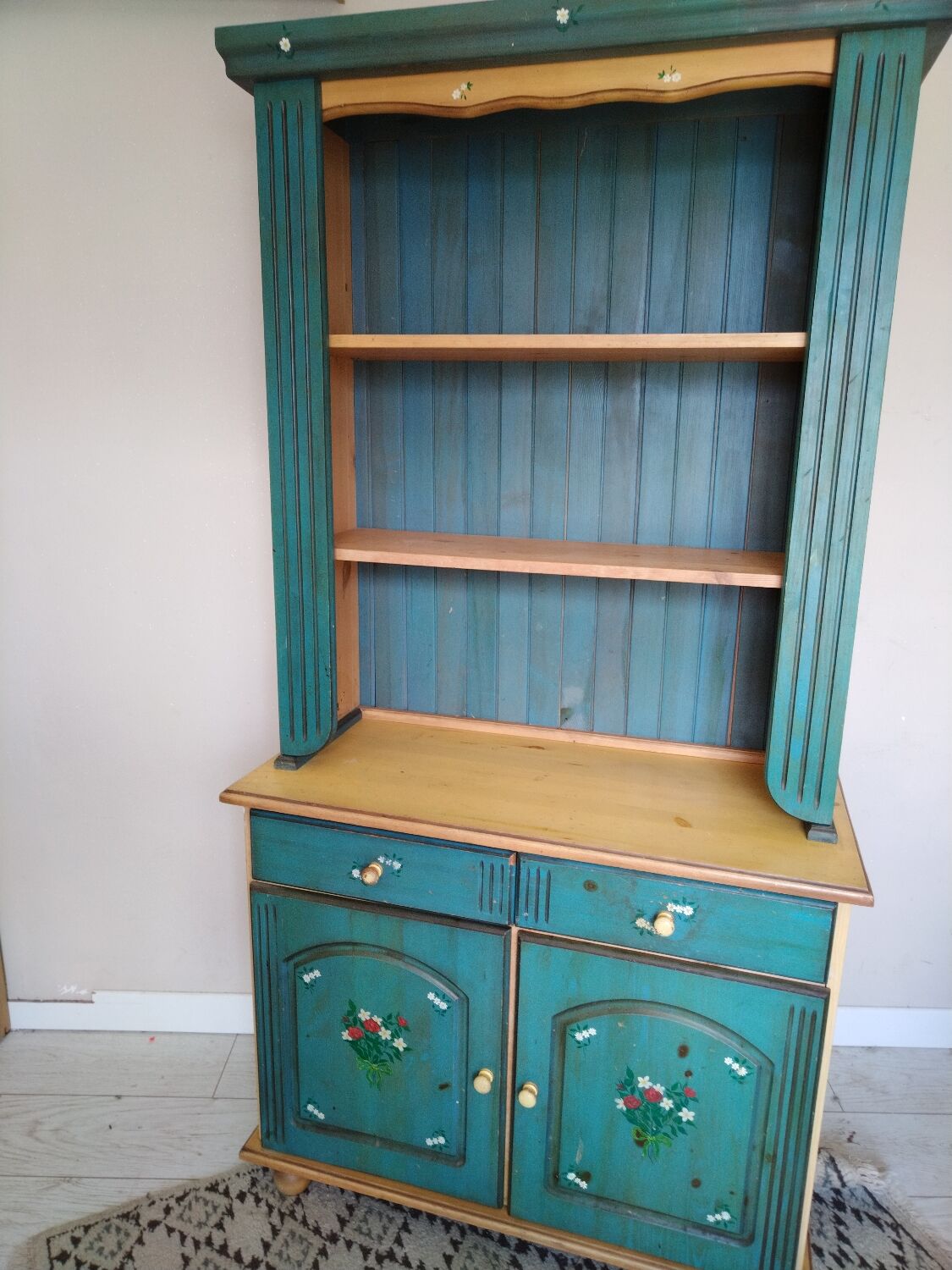 Rustic dresser with floral decor