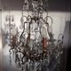 Louis XV-style bronze cage and crystal Baccarat chandelier
