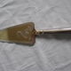silver metal knife and cake shovel