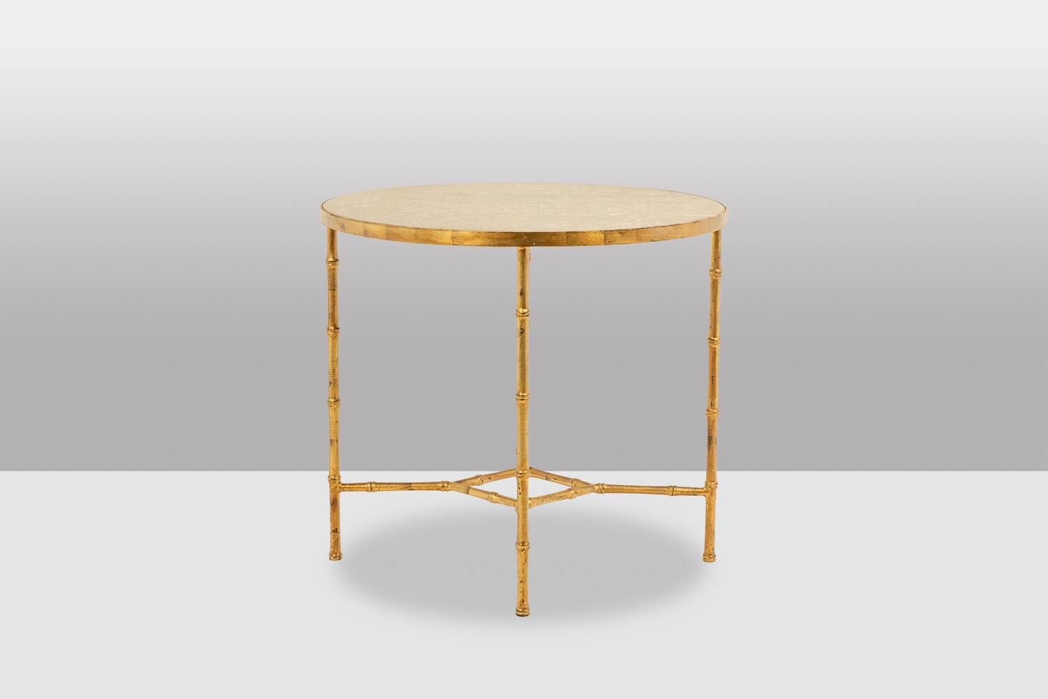 Golden metal side table with a grey marble top, 20th century.