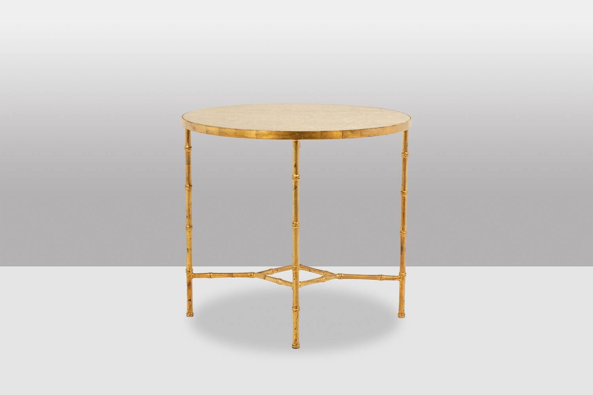Golden metal side table with a grey marble top, 20th century.