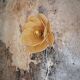 Flower wall light made of rattan and raffia petals