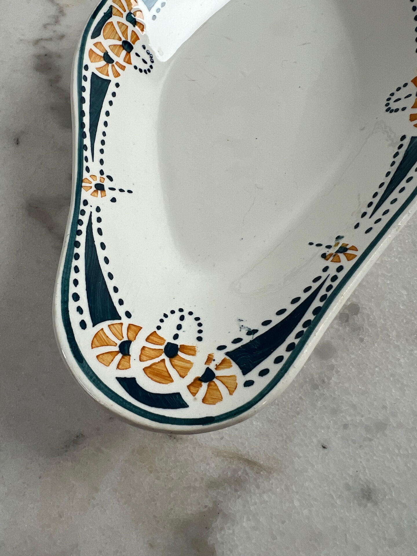 Longwy ramekin with blue and orange floral decoration.