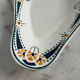 Longwy ramekin with blue and orange floral decoration.