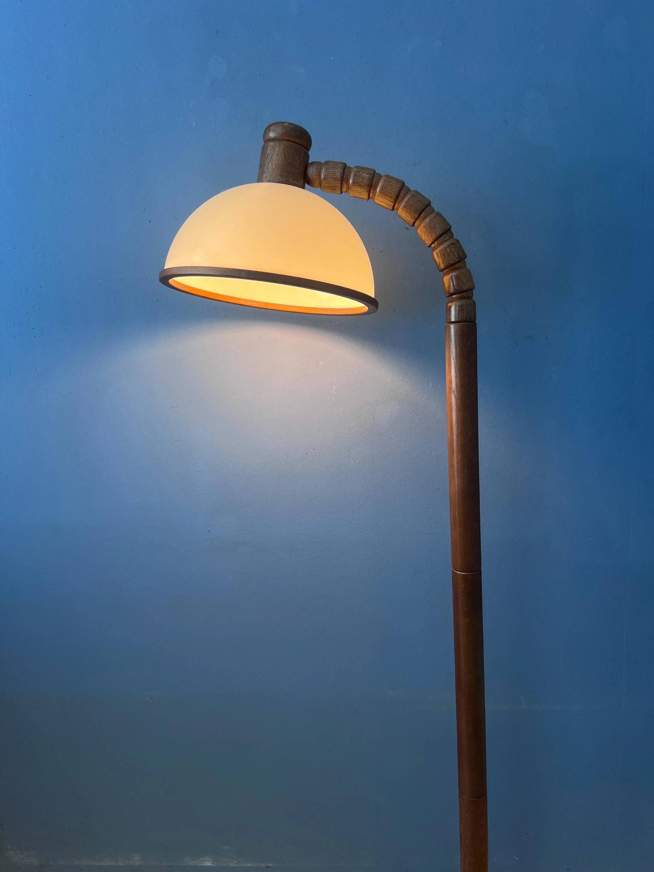 Mid-century floor lamp in brown wood by Steinhauer with an acrylic glass shade.