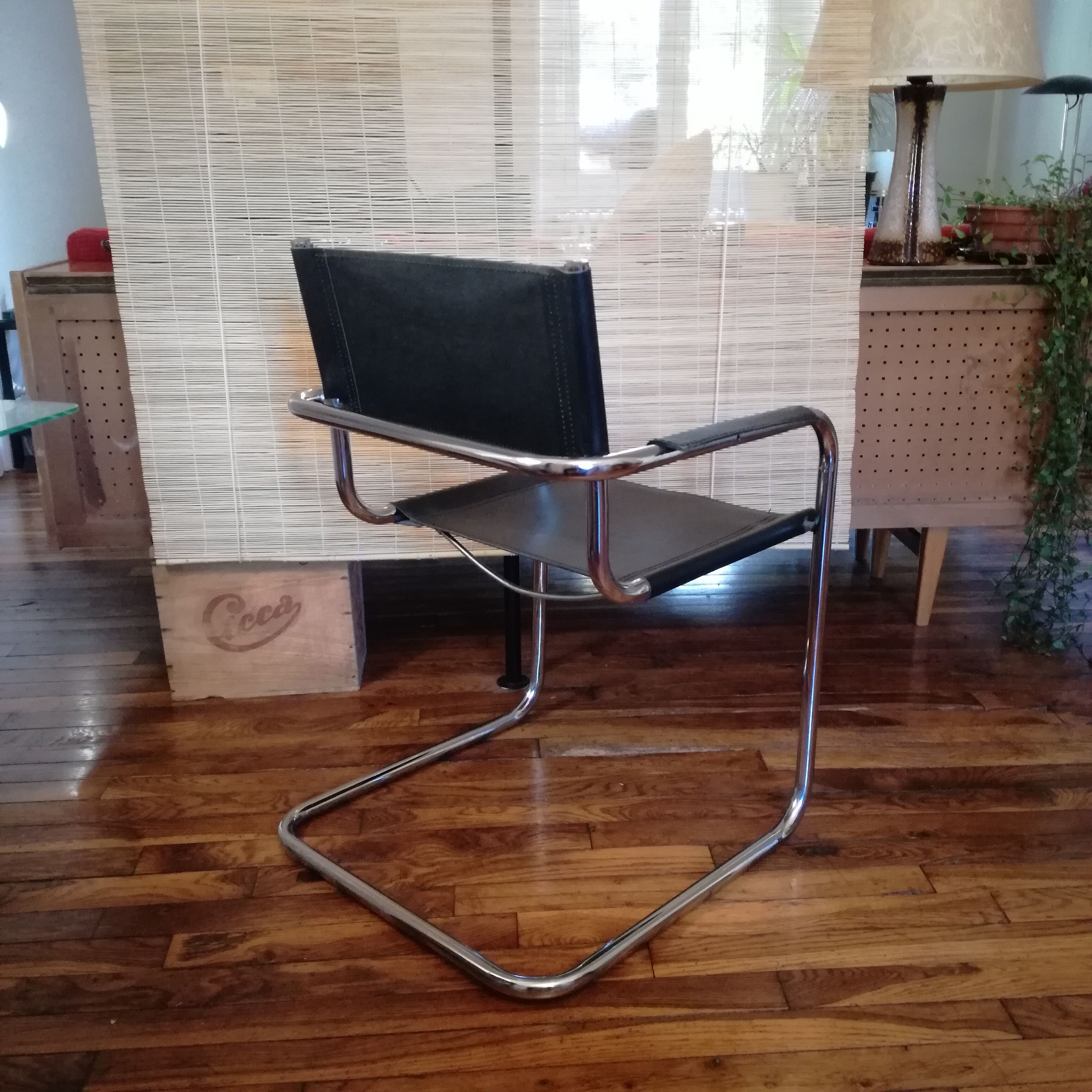 Black leather cantilever armchair