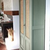 Caned cabinet with oranges