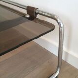 Coffee table in chrome, leather, and smoked glass