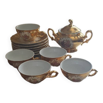 Set of cups and saucers with sugar bowl