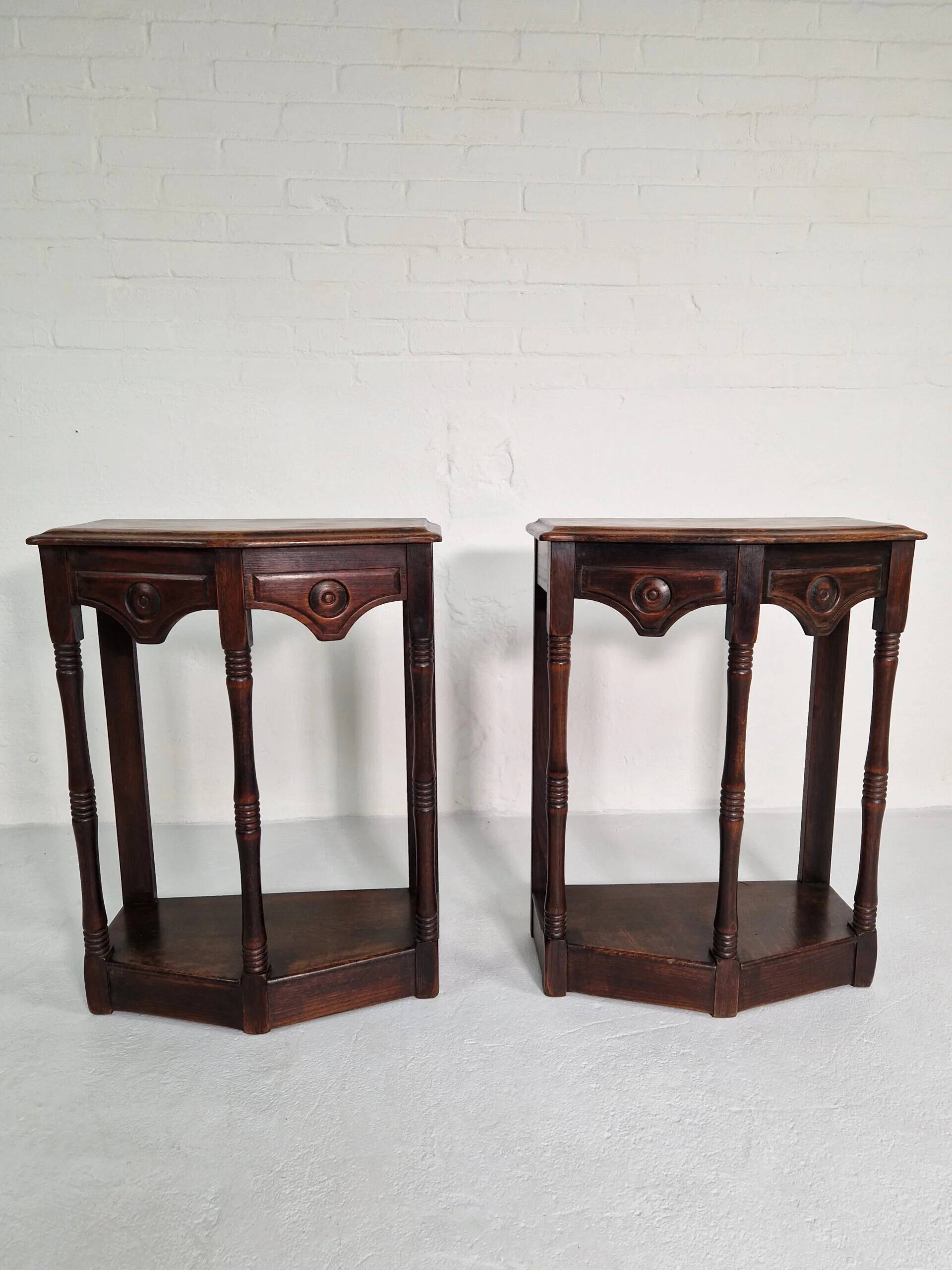 Pair of English 1920s carved oak sidetables