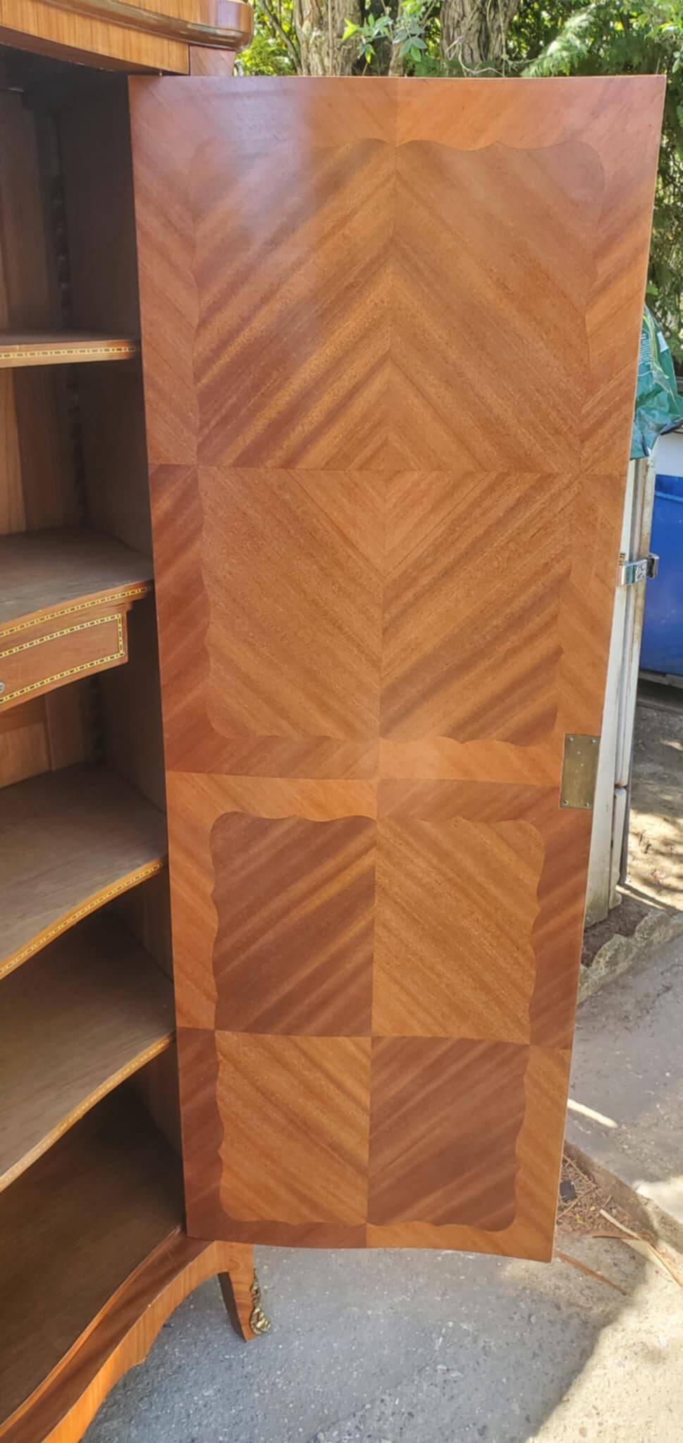Two-door cabinet with marquetry floral design from the early 20th century.