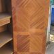 Two-door cabinet with marquetry floral design from the early 20th century.