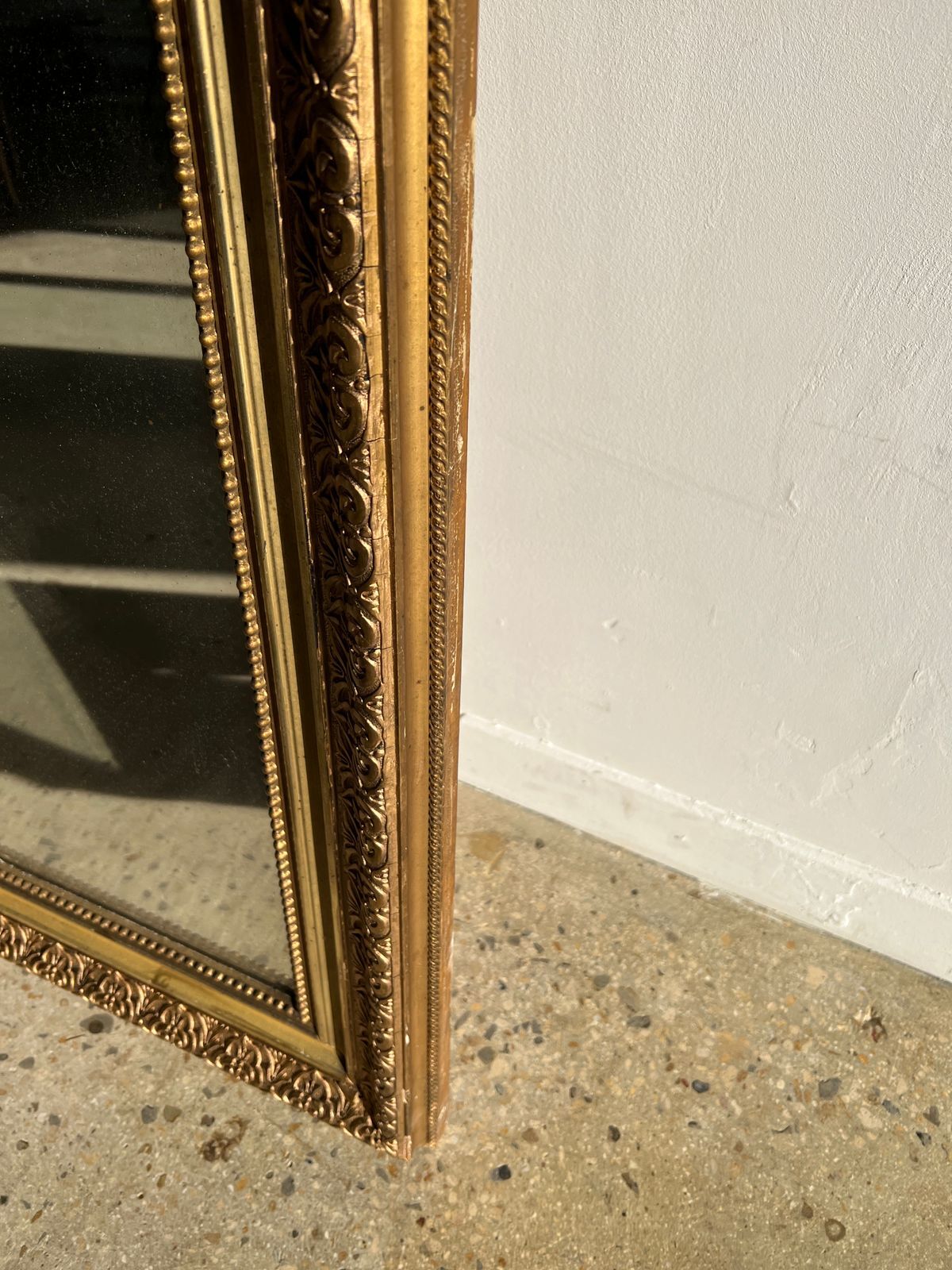 Gilded mirror with frieze h2m10 l:73cm