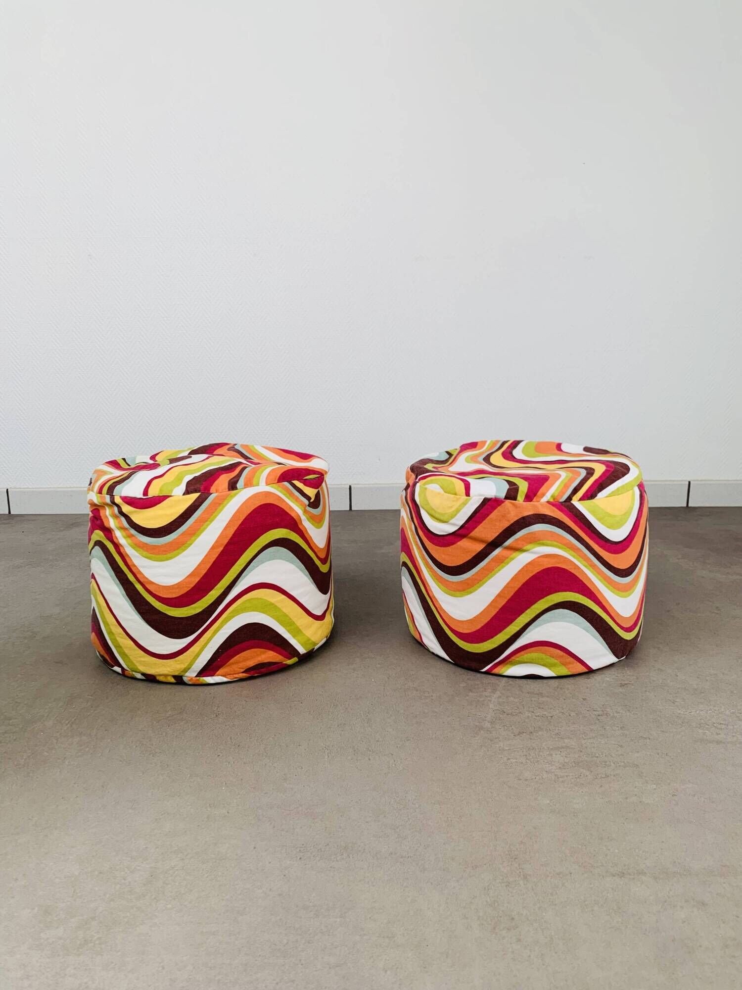 Pair of "psychedelic" fabric poufs from the 70s.