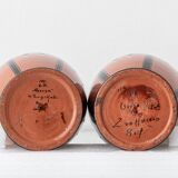 Pair of Dutch Art Deco vases, hand-painted Gouda-style ceramic with bold glazing.