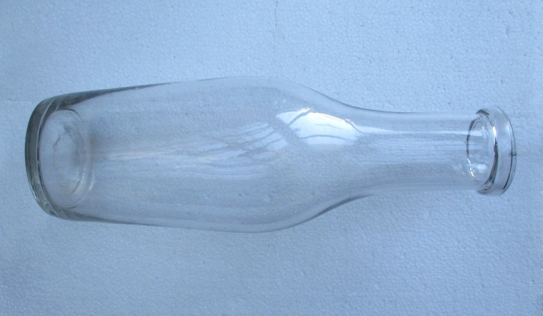 Large antique bottle made of blown glass