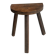 Antique wooden tripod stool with a semi-circular seat.
