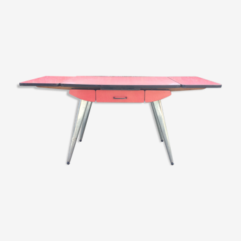 Vintage stretch table in red Formica with chrome compass feet.