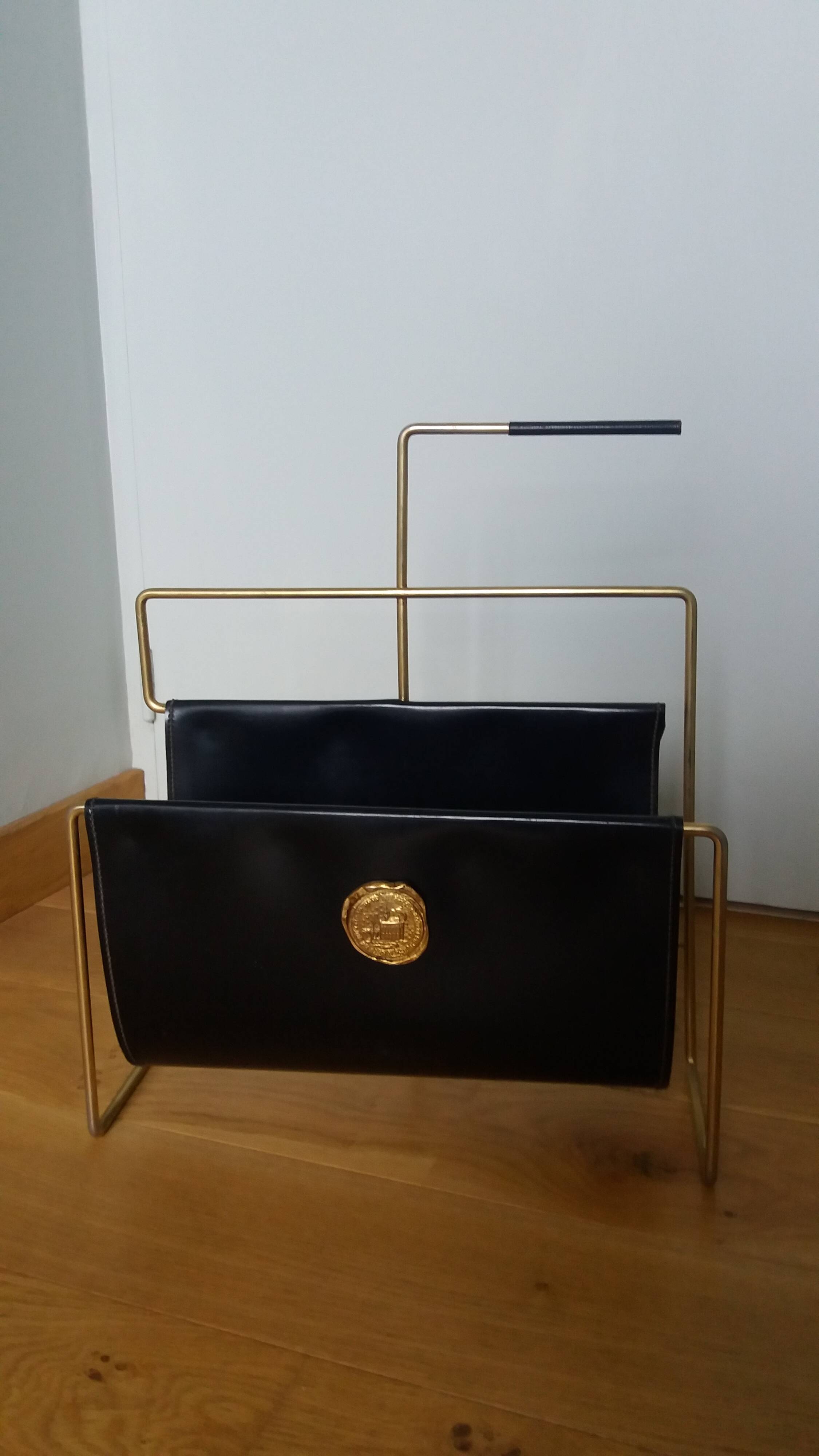 Modernist magazine rack in the style of Jacques Adnet