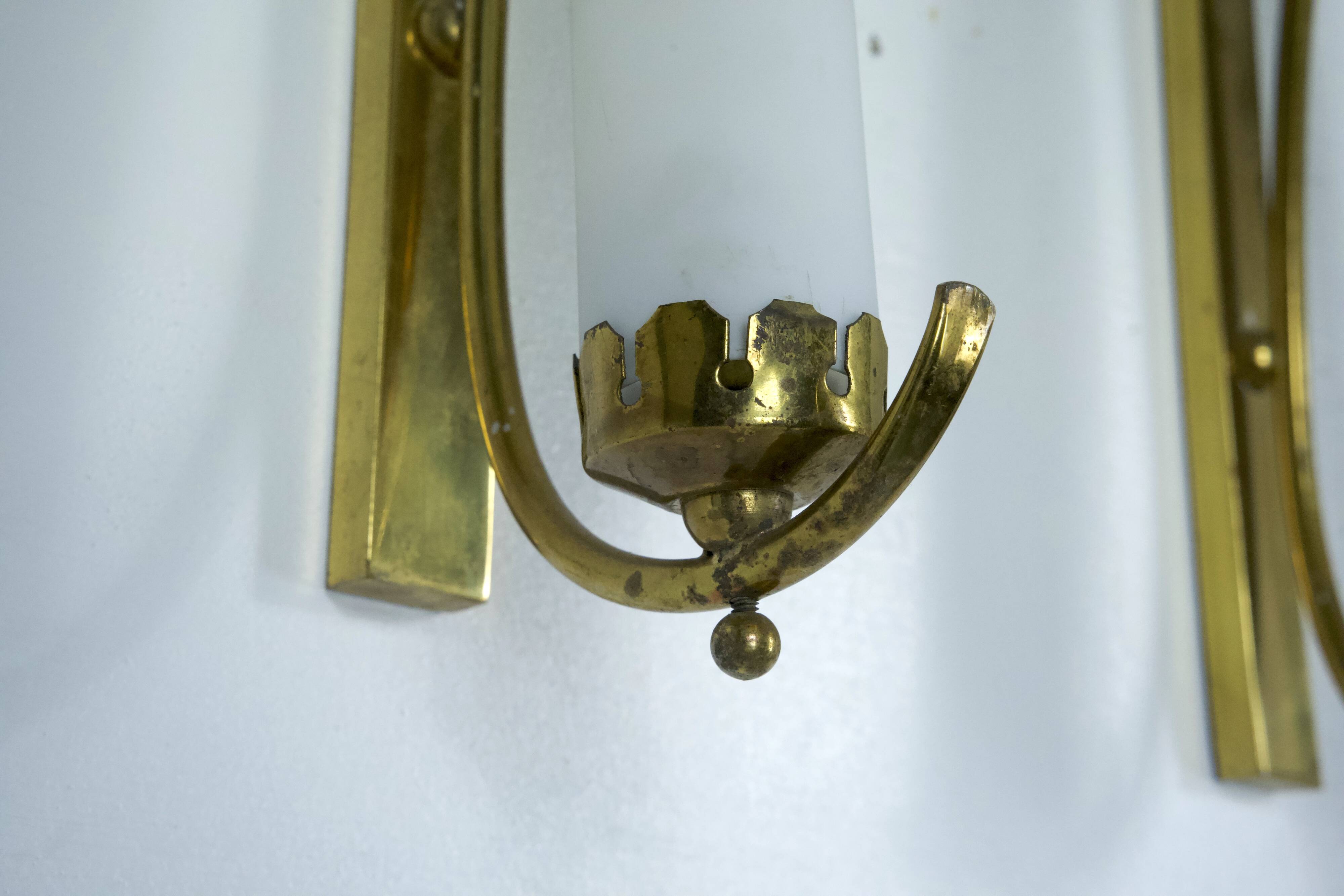 Set of three sconces in brass and triplex opaline glass. Italy 1950s