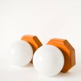 Pair of globe wall lights in opaline with a pine base, 1980.