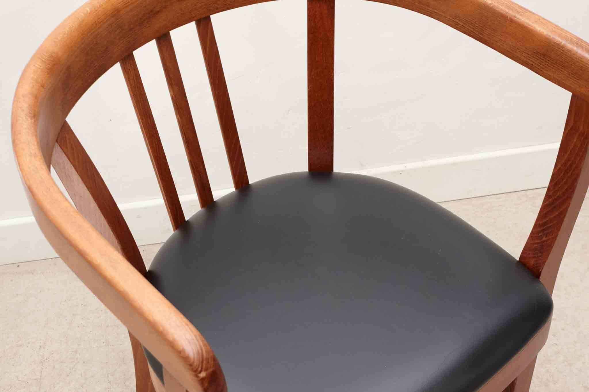 Stoelcker chair in black faux leather and oak