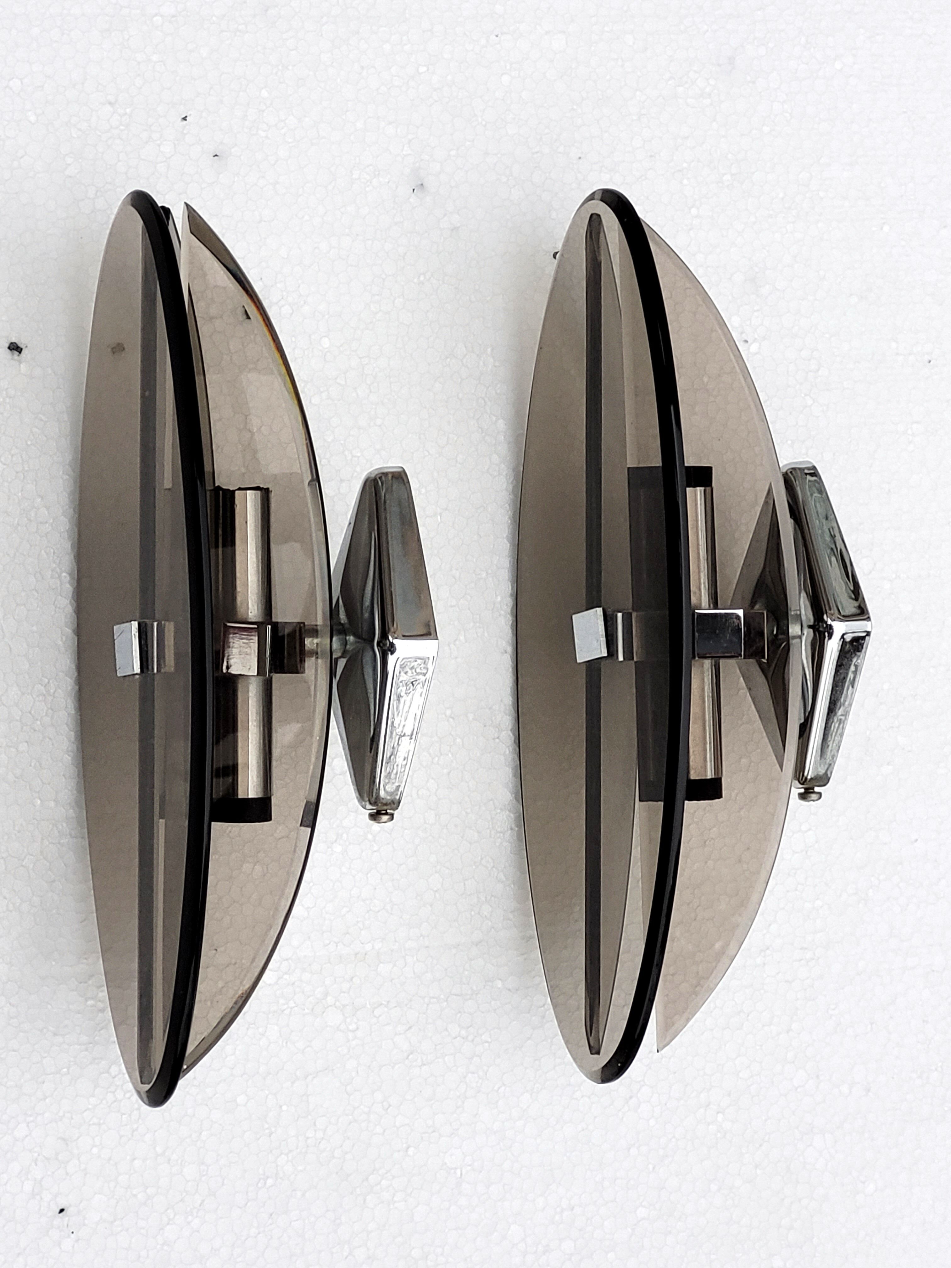 Pair of elliptical italian wall lamps in smoked glass and chrome veca