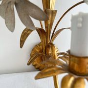 Vintage Hollywood Regency gold metal leaf wall sconce.