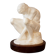 Sculpture of a seated man. Classical male sculpture. Male figure.