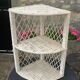 Corner shelf in rattan and vintage white wicker