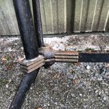 Vintage bistro table with an Art Deco style cast iron base and Formica top.