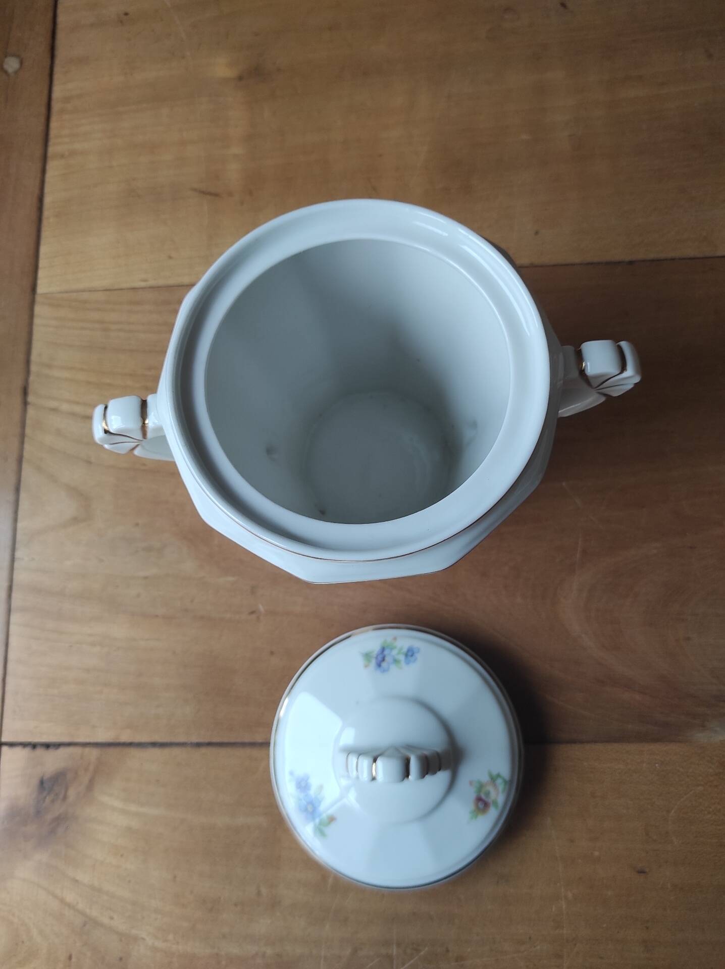 Antique porcelain sugar bowl with a decagonal base.