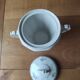 Antique porcelain sugar bowl with a decagonal base.