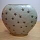 Small vintage soliflore vase in white enamelled brass with golden stars.