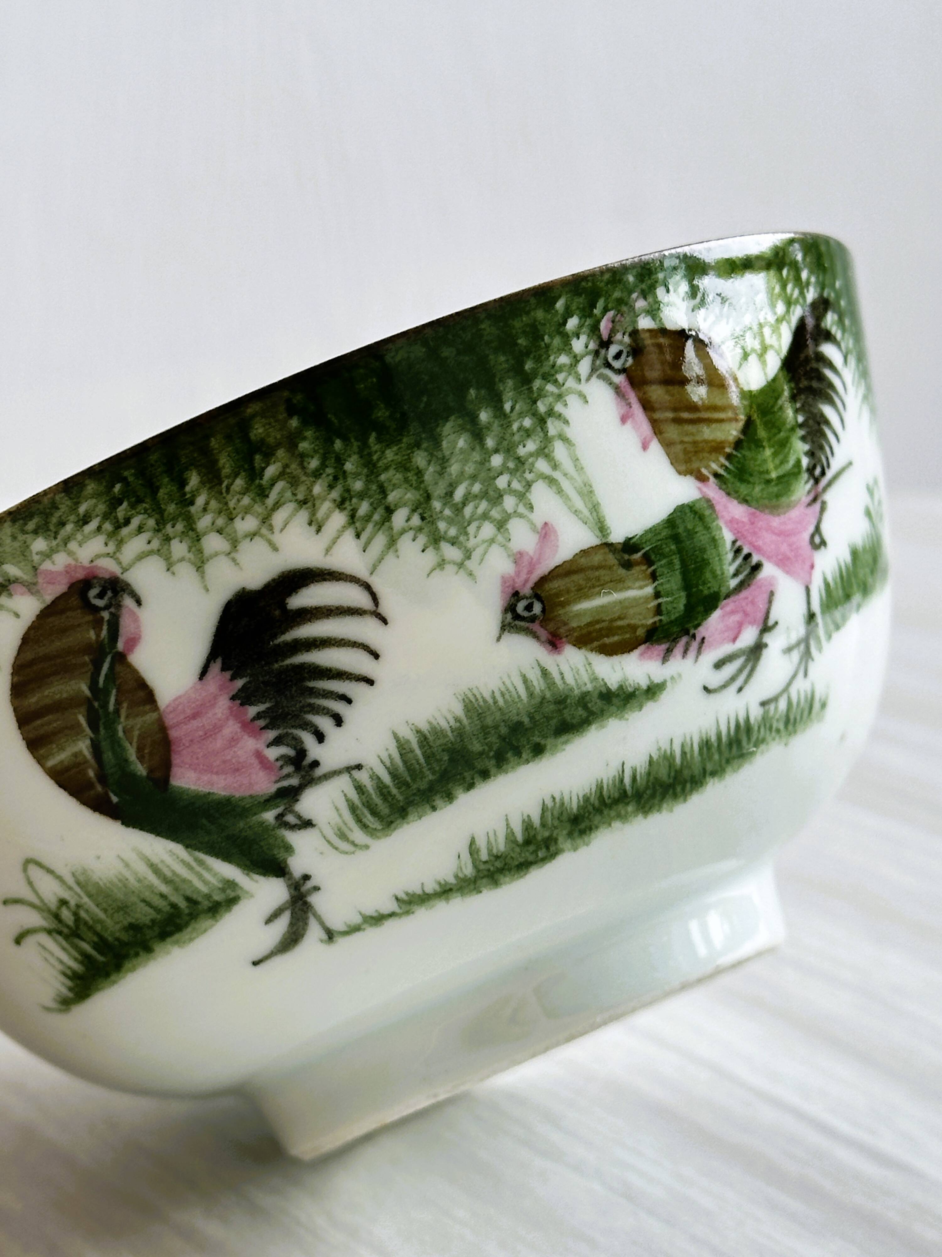 Antique porcelain bowl with rooster motif