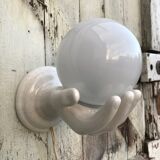 Hand-shaped ceramic wall light