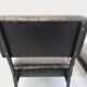 Set of 2 vintage modernist armchairs in black faux leather and metal.