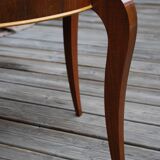Table basse art déco de forme ronde en palissandre de rio.