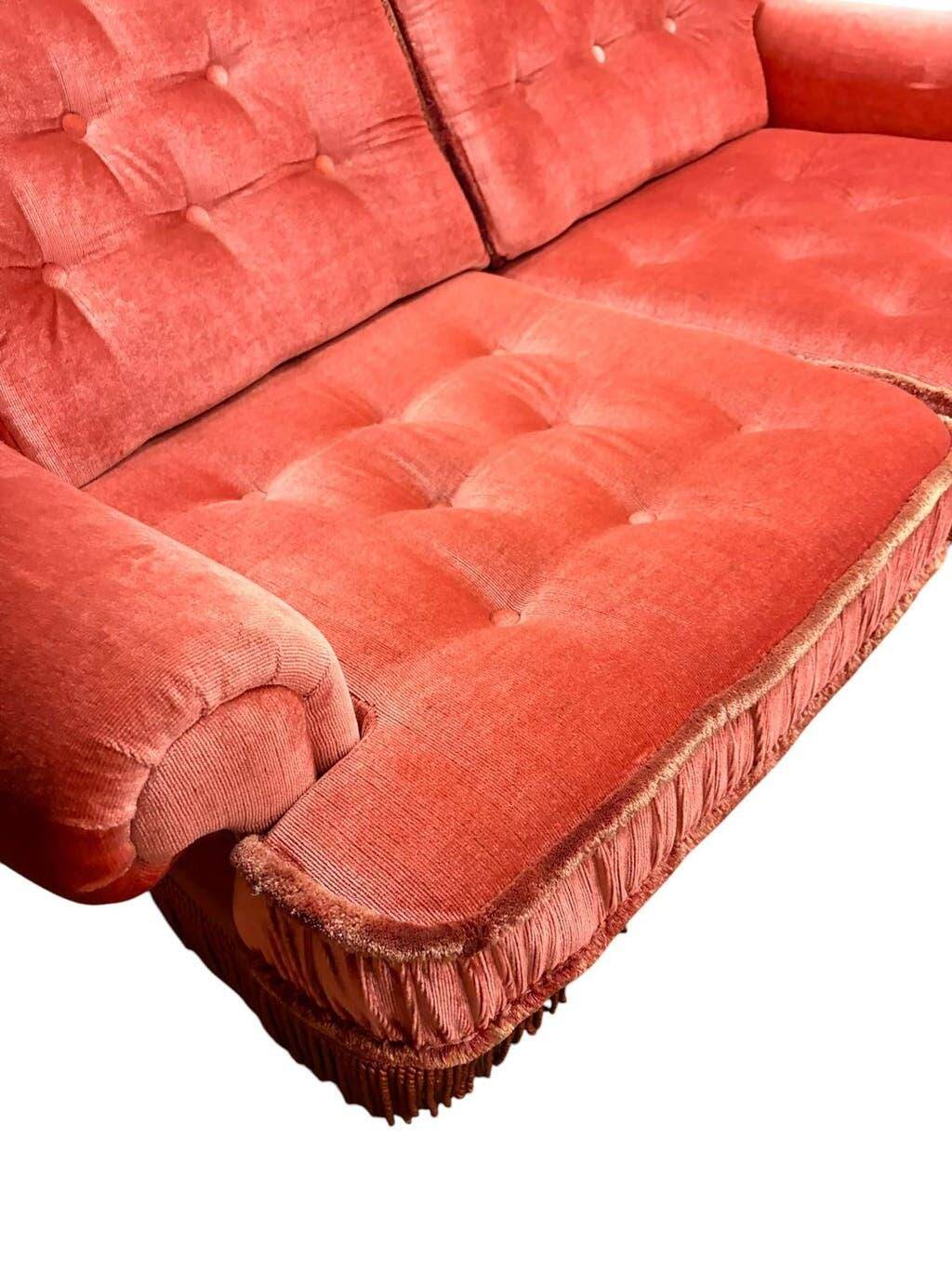 Vintage pink two-seater sofa with fringes