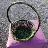 Green wicker basket with a large vintage handle