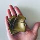 Empty pocket square of aces in brass