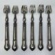 Set of 6 silver-plated oyster forks with 7 knot pattern filigree.