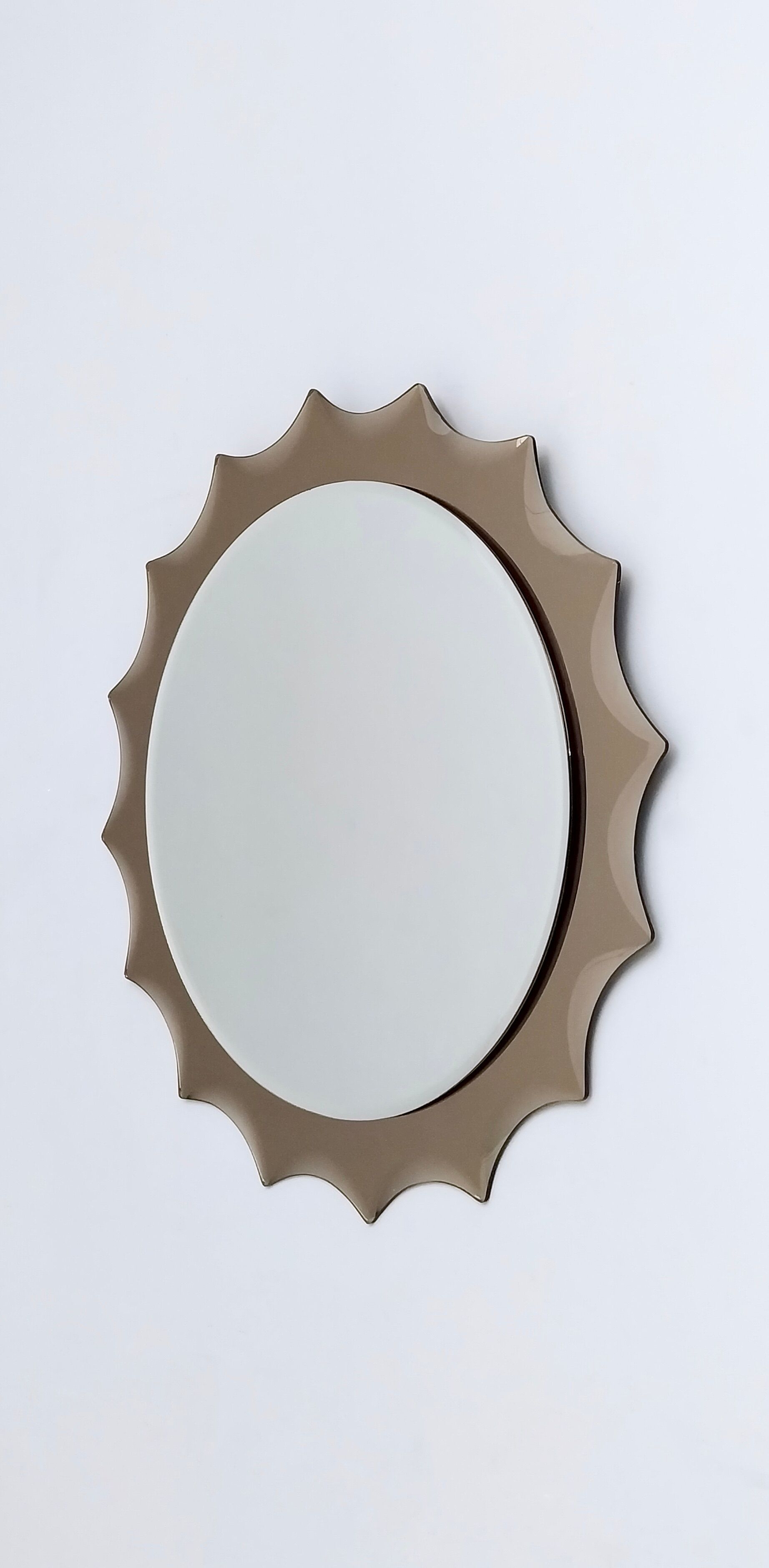 Postmodern sun shaped bronze wall mirror, italy