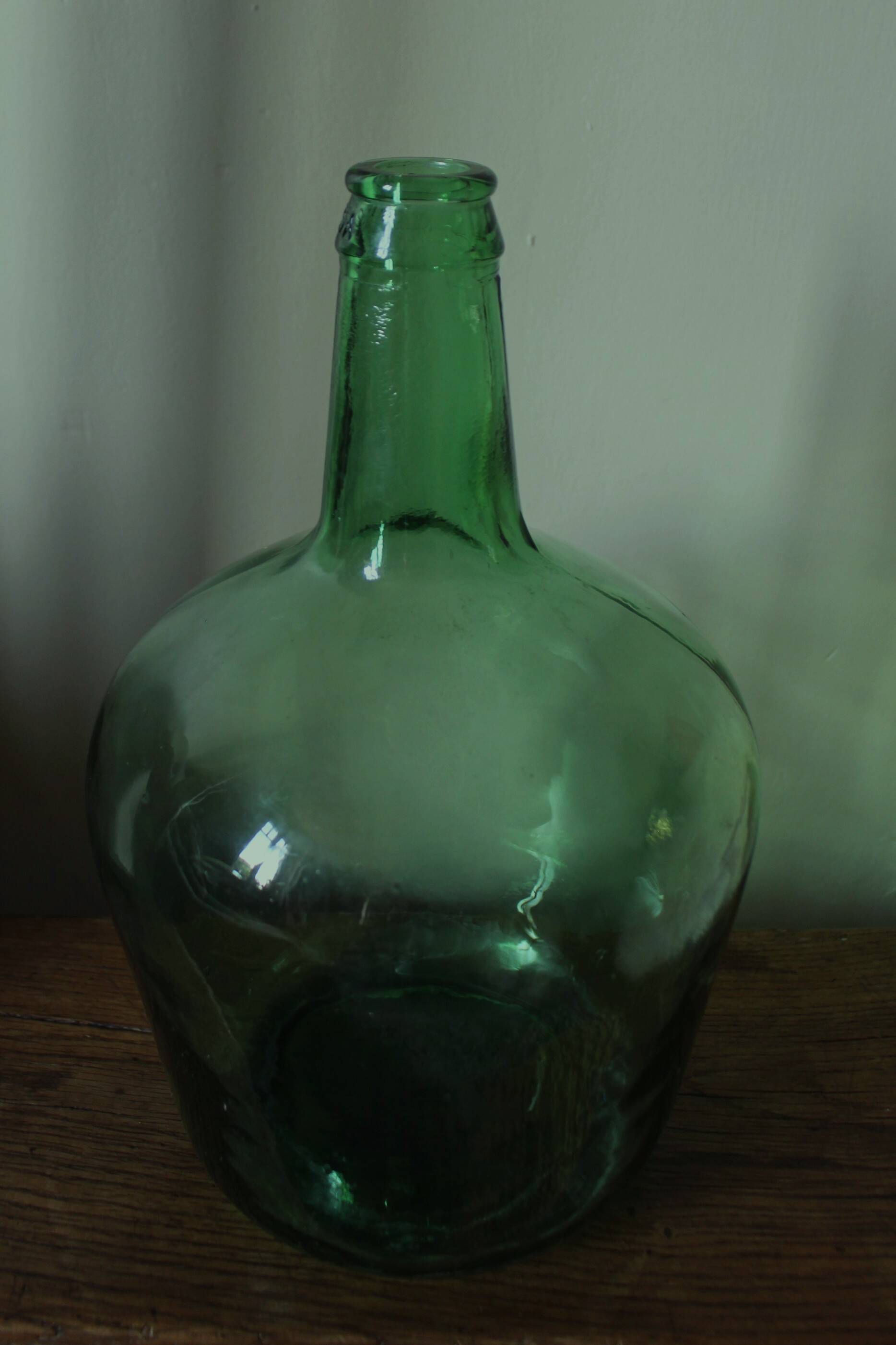 Give me a dark green glass Bonbonne jar.