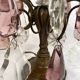 Pair of bronze chandeliers with tassels