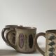 Set of 2 glazed ceramic coffee mugs from around 1970.