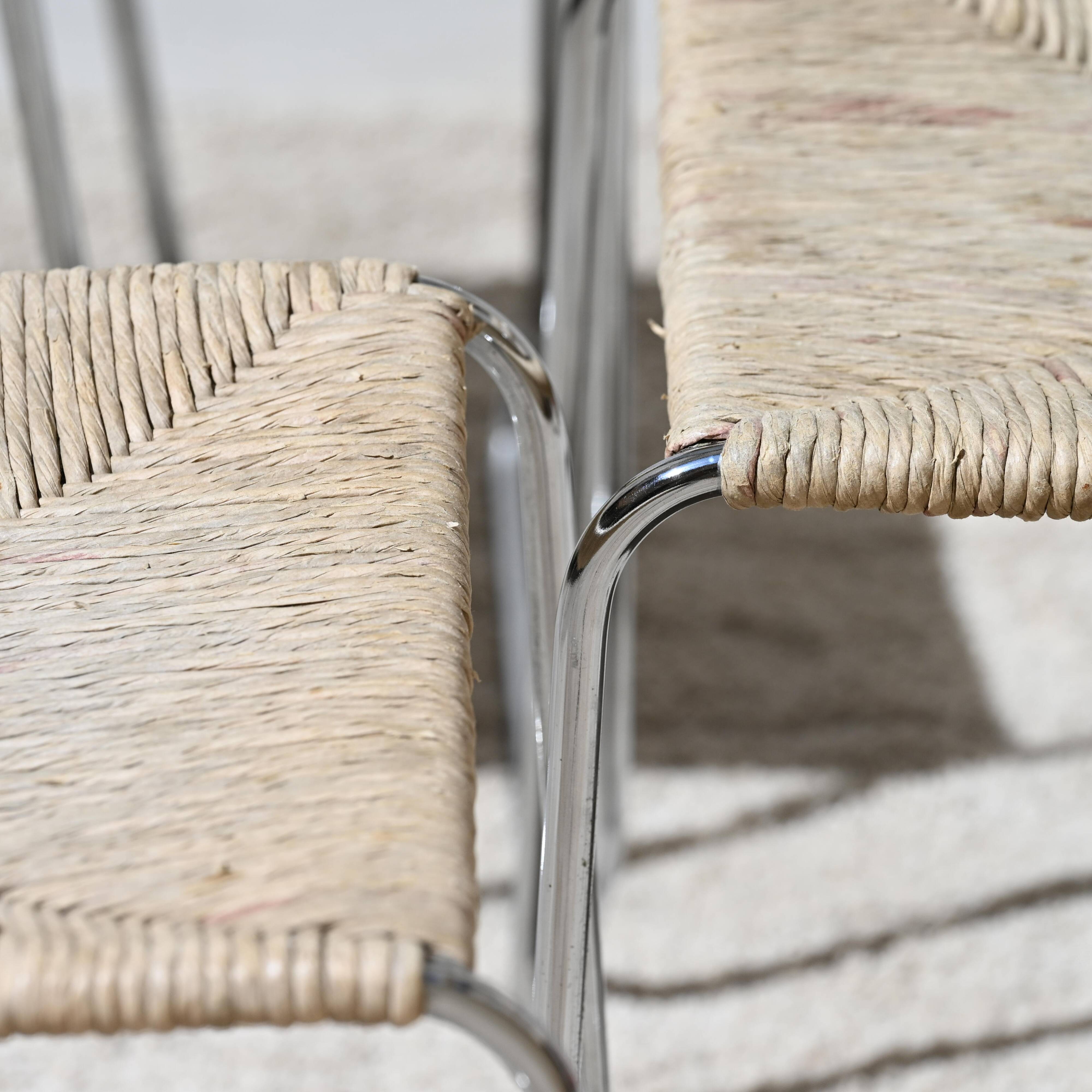 Four straw-seated chairs from 1980.