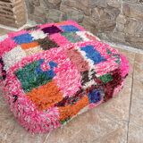 Berber floor pouf: Handwoven Moroccan wool cushion.