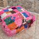 Berber floor pouf: Handwoven Moroccan wool cushion.